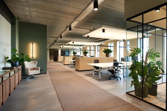 a large open space with a desk and chairs- Residency Clayworks