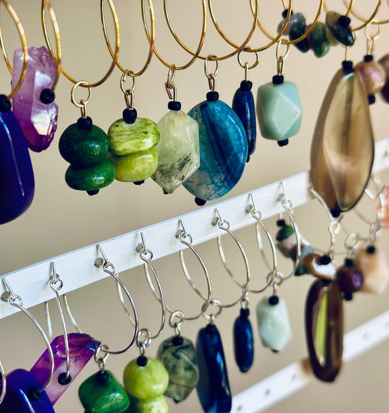 assorted gorgeous wine charms in many colors