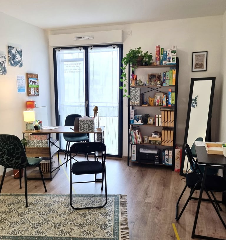 a living room with a table and chairs