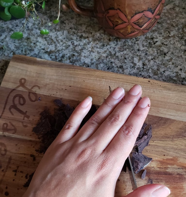 Iveth Balanta cutting cacao paste