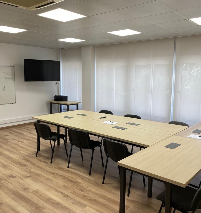 a conference room with a table and chairs