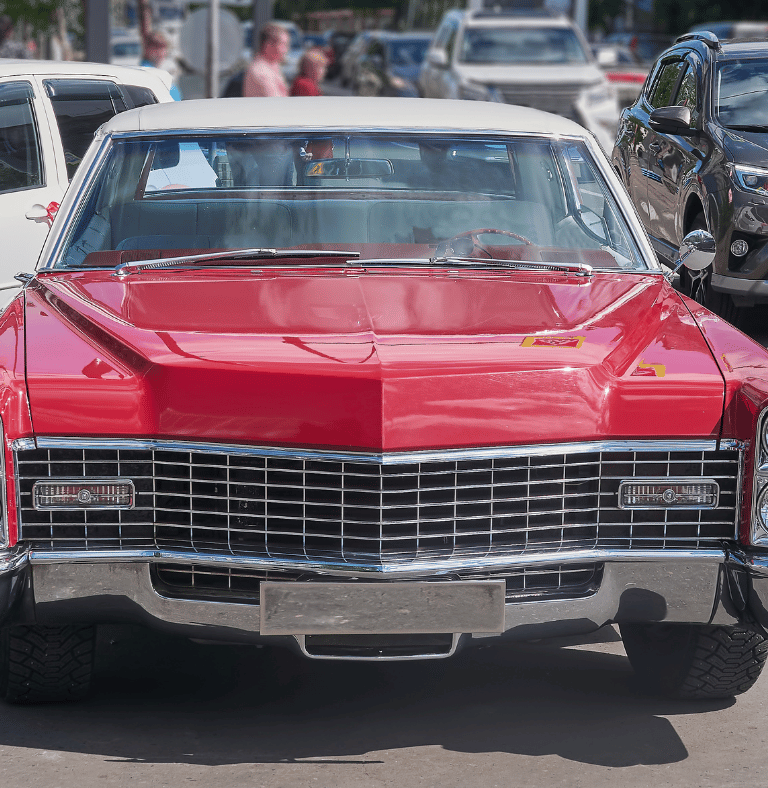 a red car parked in a Surrey parking lot