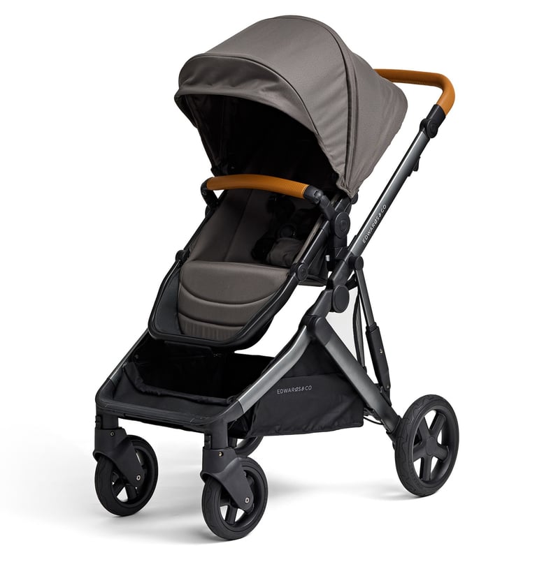 Product photography - a stroller with brown leather handles