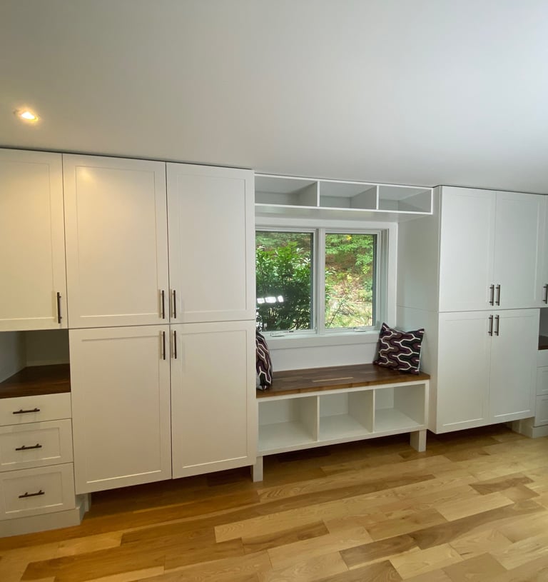 wall to wall cabinetry with window seat area