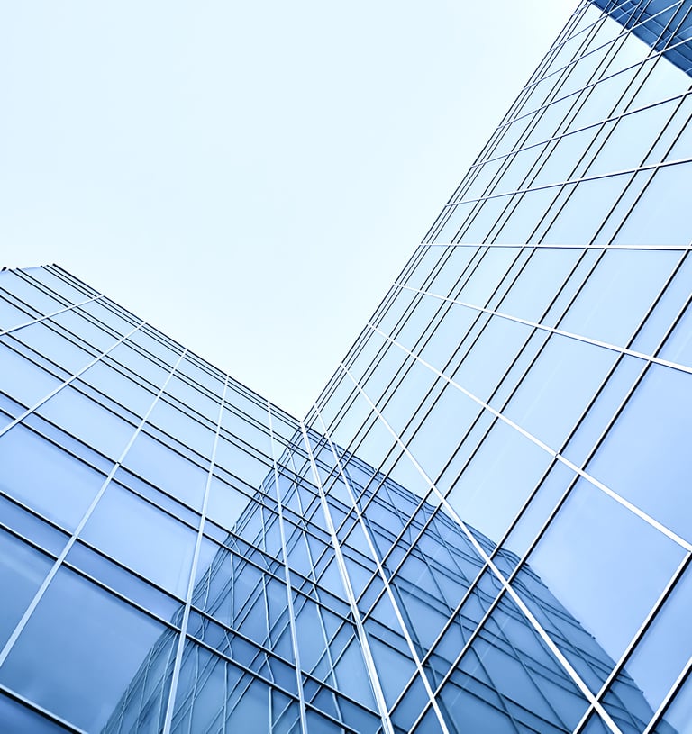 upward angle of an L shaped glass window building