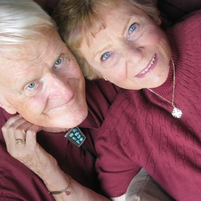 a man and woman with blue eyes looking at the camera