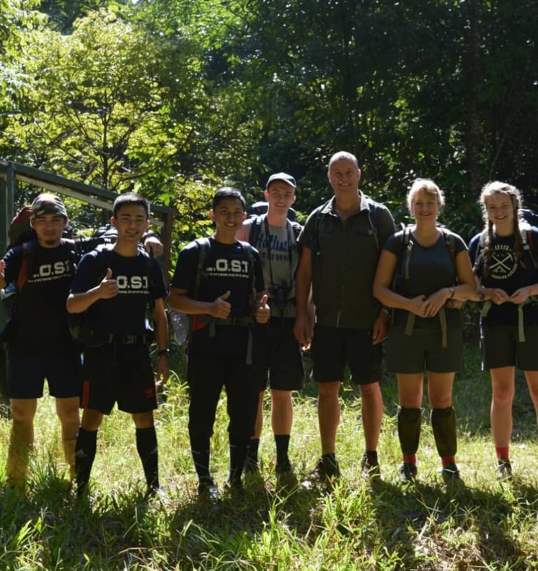 a group of people standing at the starting point of the Maliau Basin trek