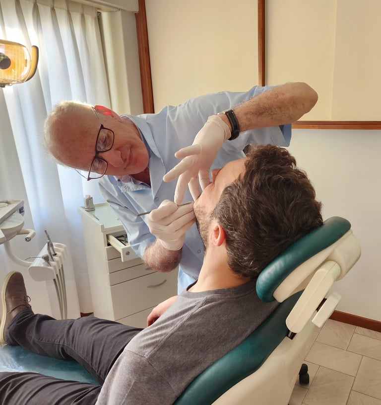 a man in a dentist's chair with a glove on his hand