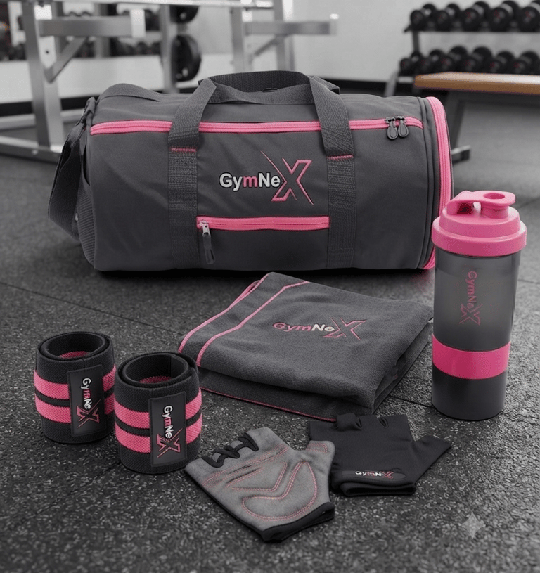 GymNex grey and pink fitness gear set with duffel bag, shaker bottle, towel, and lifting gloves on a gym floor.