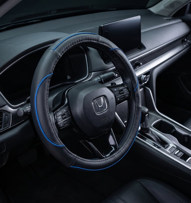 Black leather steering wheel cover with blue trim installed in a modern Honda vehicle interior.