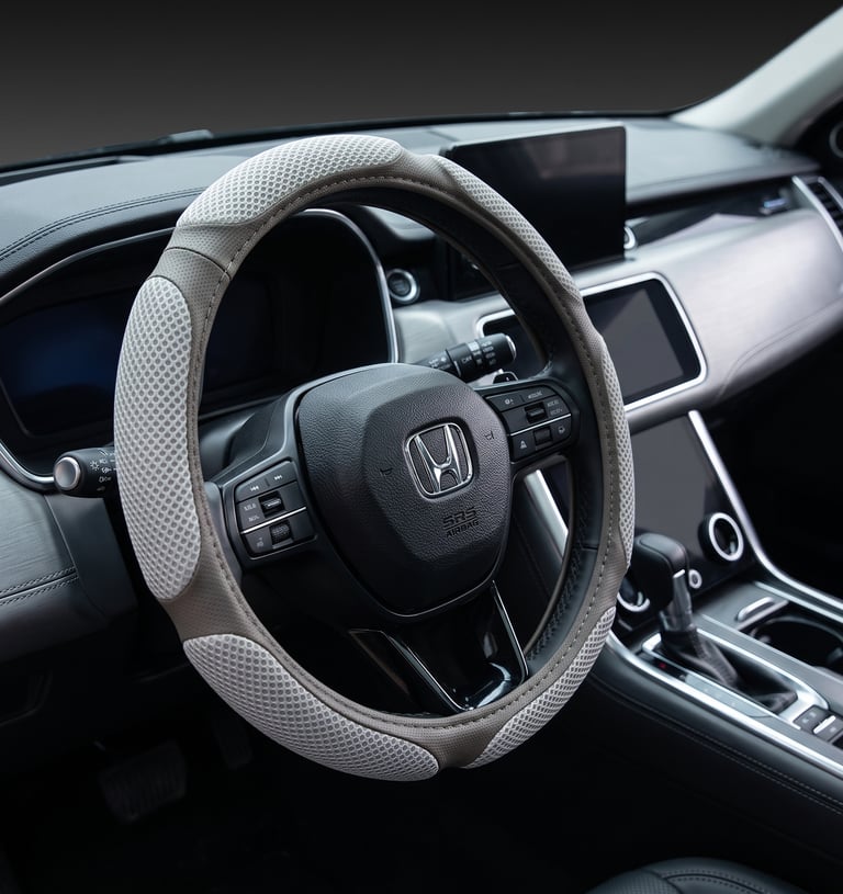Breathable mesh grey steering wheel cover installed on a Honda car interior dashboard.