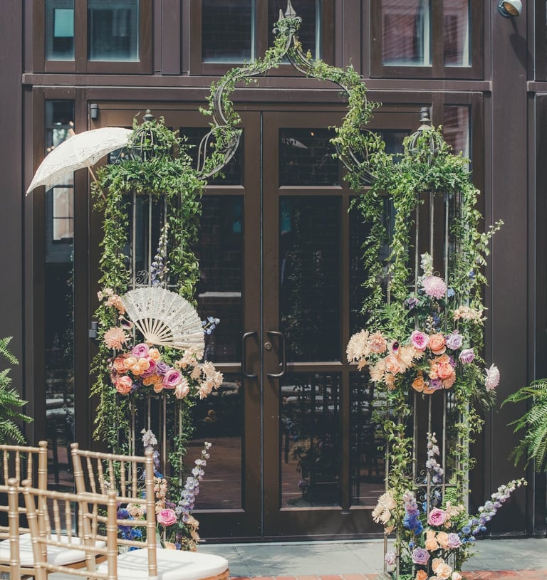 a wedding ceremony with umbrellas and umbrellas