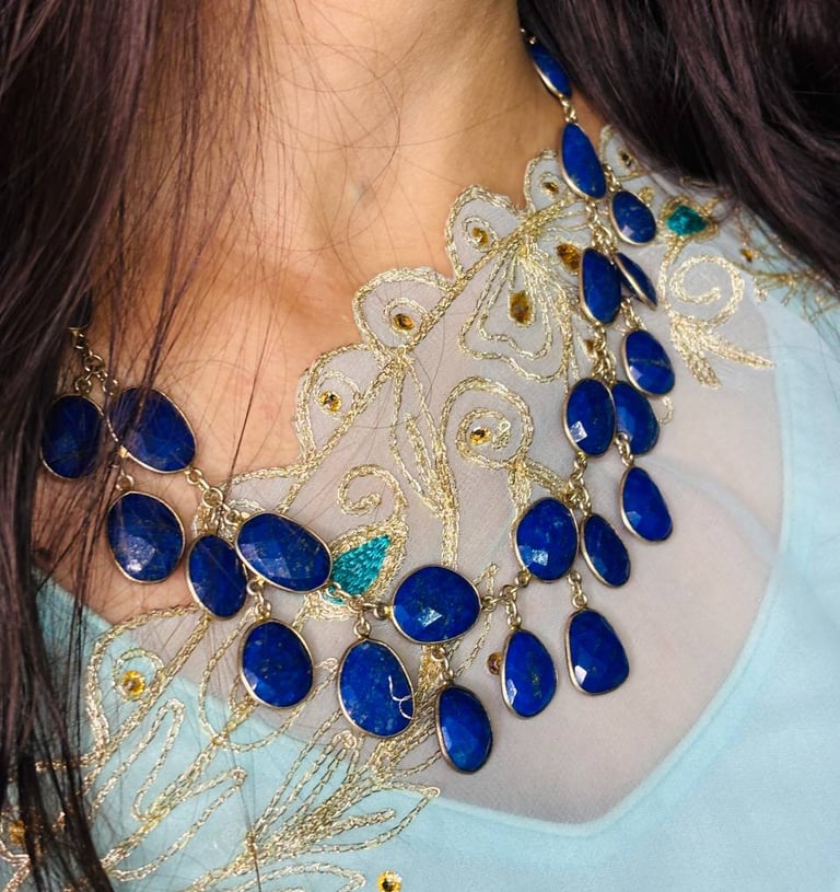 a woman wearing a Lapis Lazuli Necklace