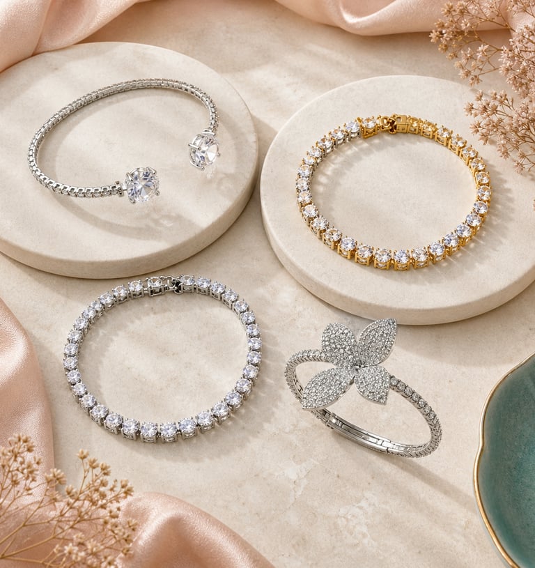 Elegant diamond tennis bracelets and a floral diamond cuff displayed on marble pedestals.
