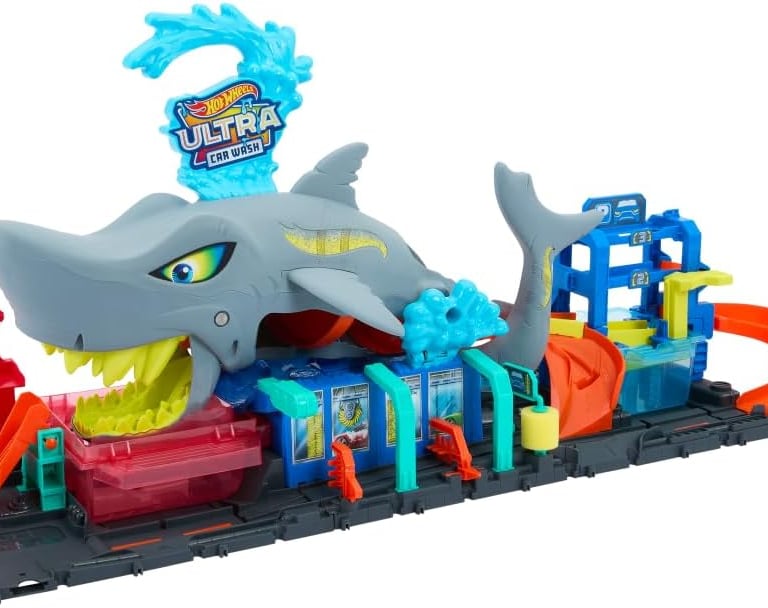 a toy shark shark and a train set