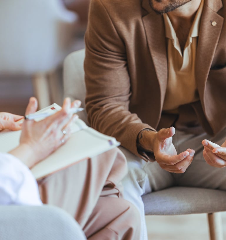 Client speaking with a wellness coach during a supportive, one-on-one session