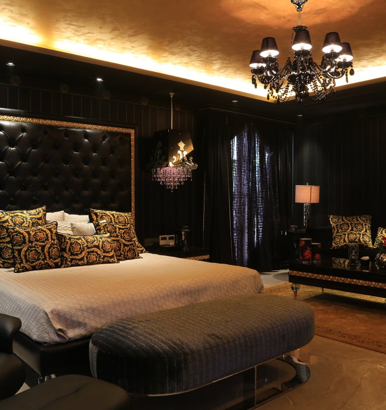 a bedroom with a bed and a couch