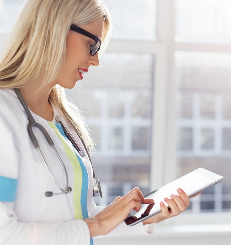 A doctor utilizes ClinicalHawk's EDC system to review and analyze clinical patient data efficiently and effectively.