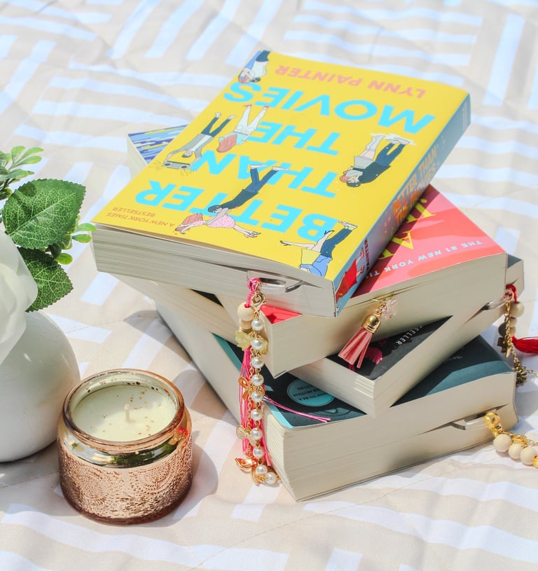 a stack of books with charmed unique bookmarks