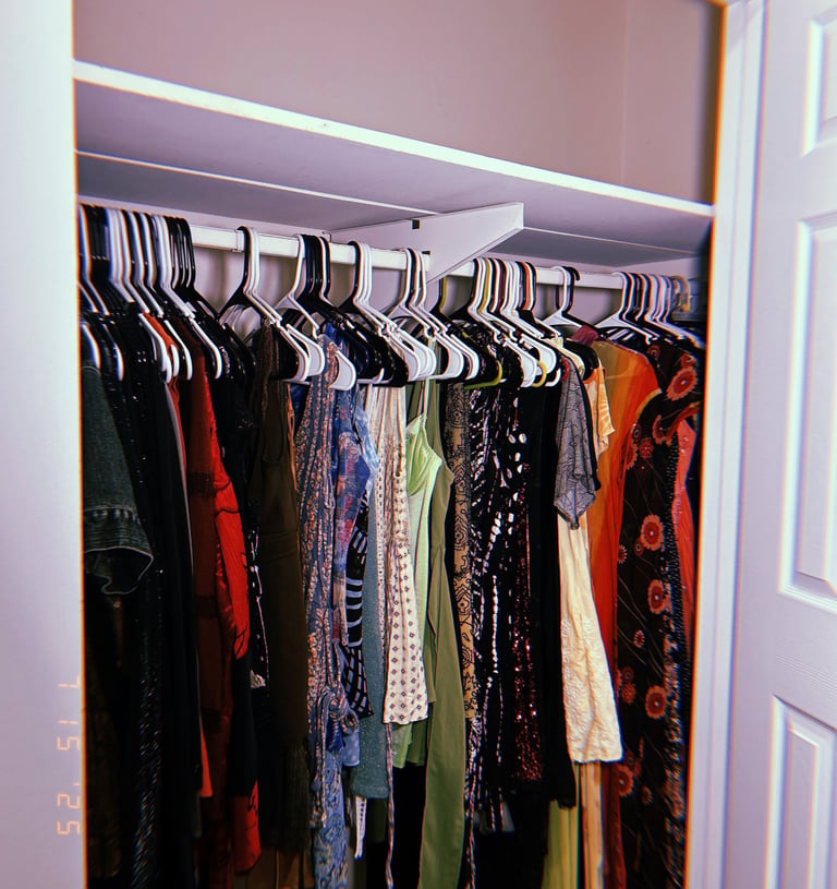 please center the clothing here to show the patterns and reduce how much of the hangers is showing