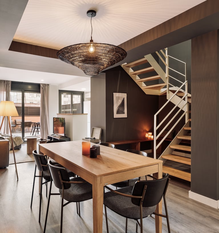 Stylish dining area with contemporary furniture, neutral tones, and a cozy interior design by SAVIA