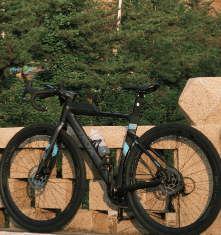 a bicycle parked on a stone wall
