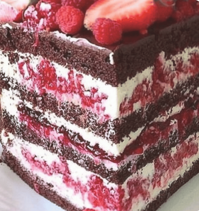 a piece of cake with strawberries on top of it