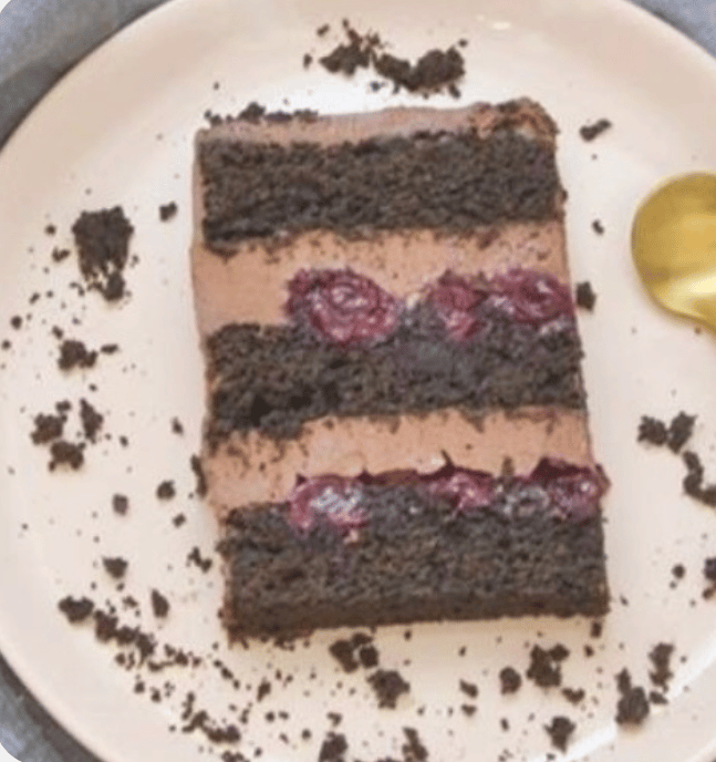 a piece of cake with chocolate frosting on a plate