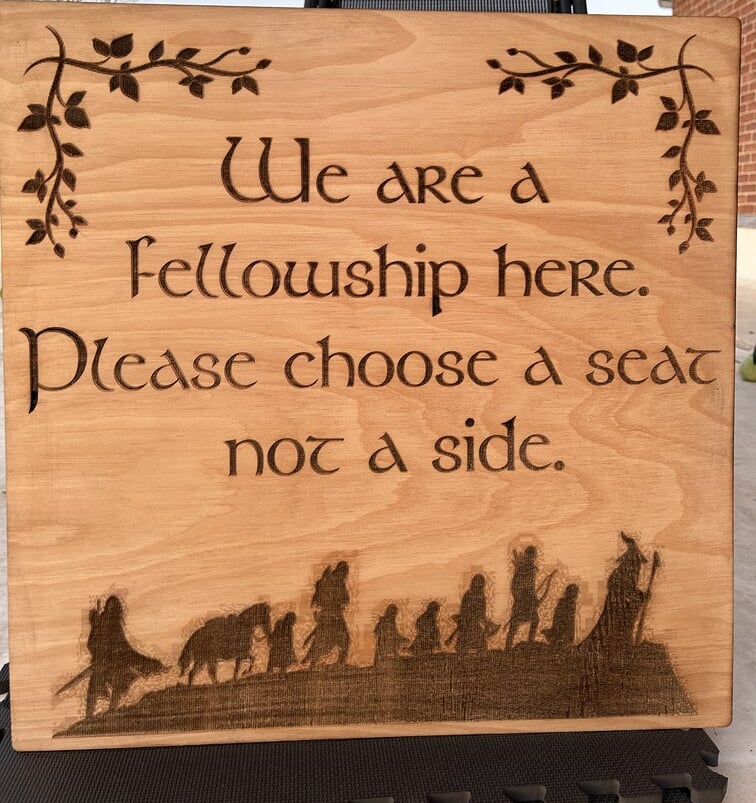 laser cut and engraved lotr fellowship wooden sign for a wedding