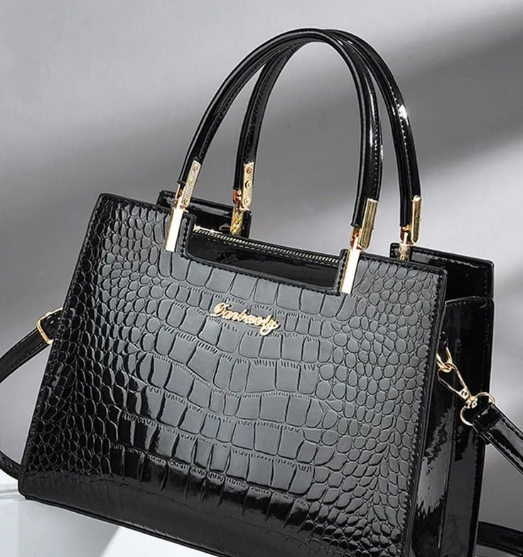 a black and white purse with a black and gold purse