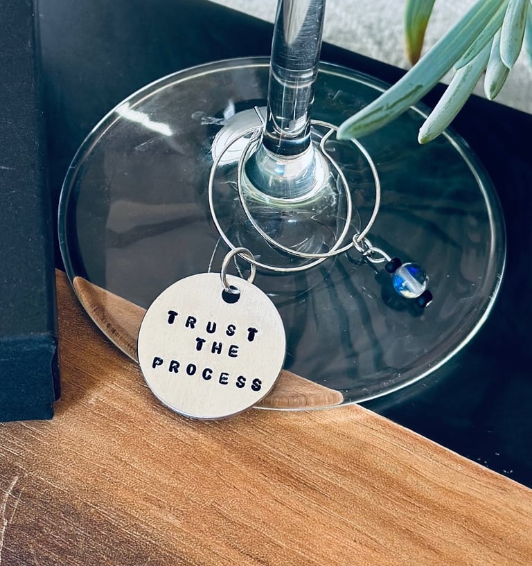 stamped trust the process wine charm