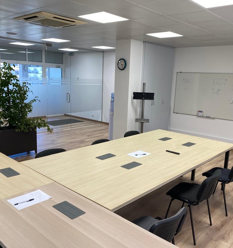 a conference room with a large table and chairs