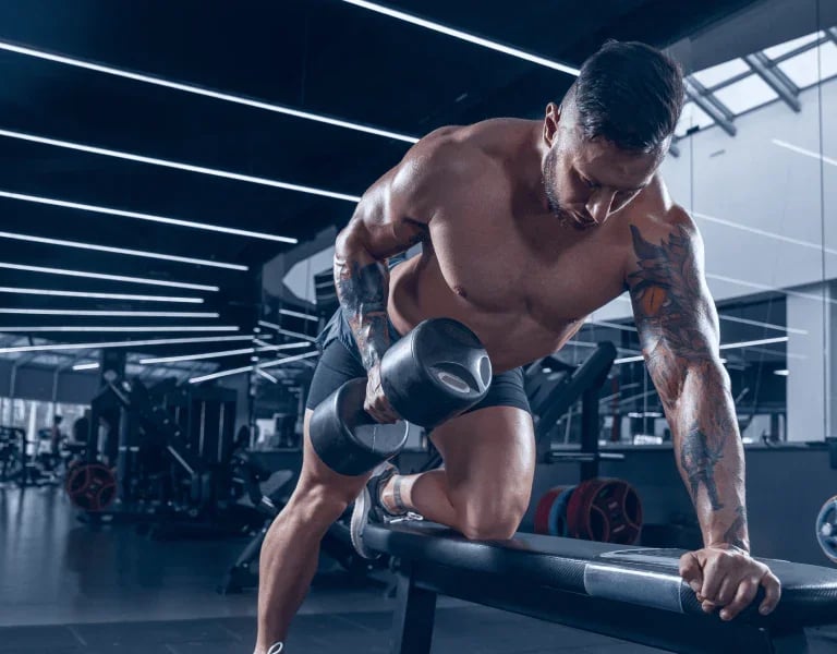 a man doing a barbell exercise on a barbell