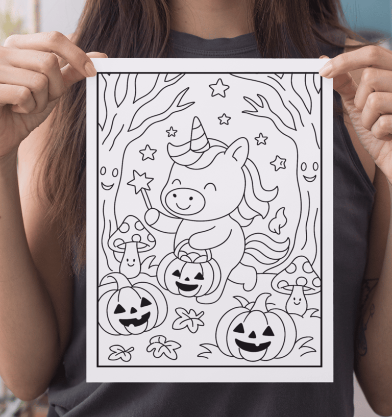 a woman holding up a coloring page for halloween