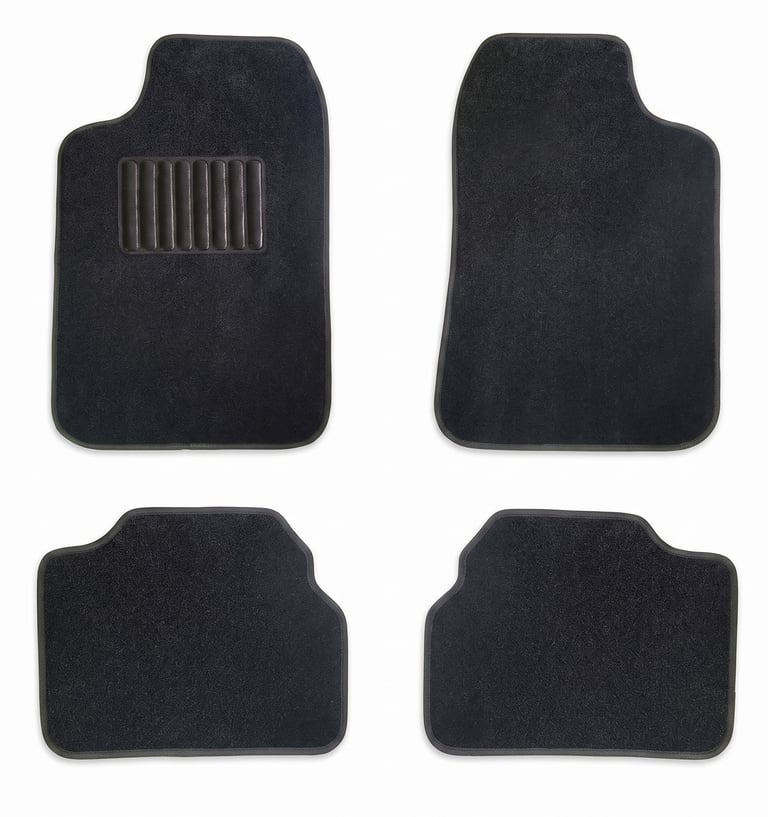 Set of four black carpet car floor mats with a protective heel pad on the driver's side mat.