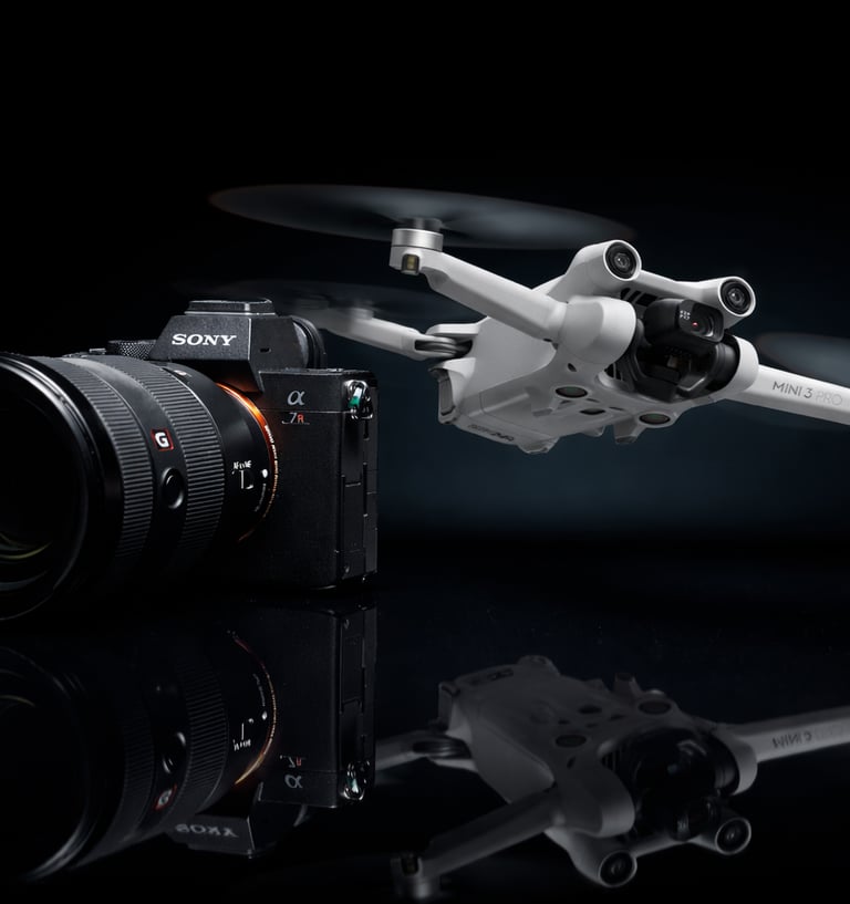 A Sony Alpha mirrorless camera with a G Master lens next to a DJI Mini 3 Pro drone on a dark reflective surface.