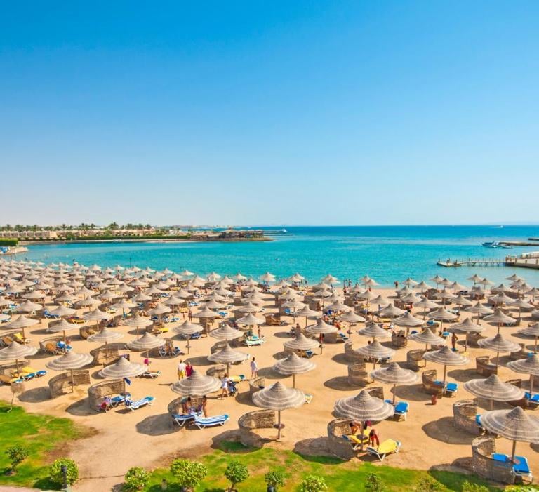 sunrise garden beach with umbrellas and umbrellas on the beach