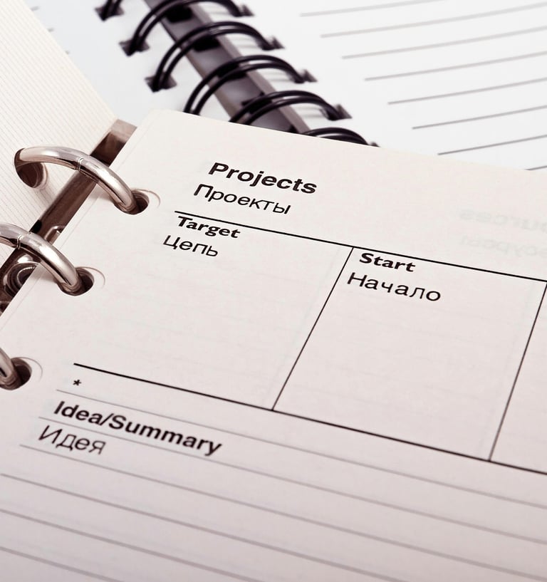 a notebook with a notepad and a pen on it