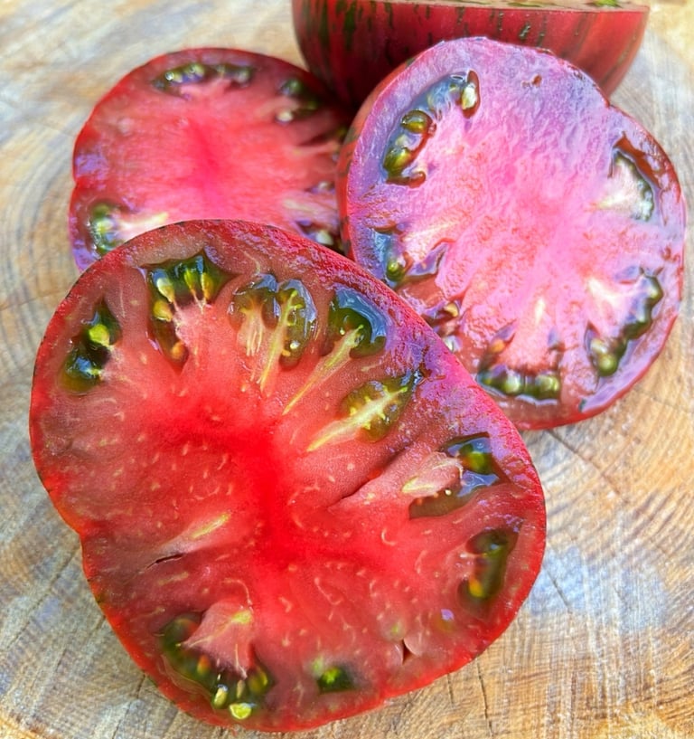 Suffer Well’ tomato, a deep red, round heirloom variety with smooth skin and juicy flesh