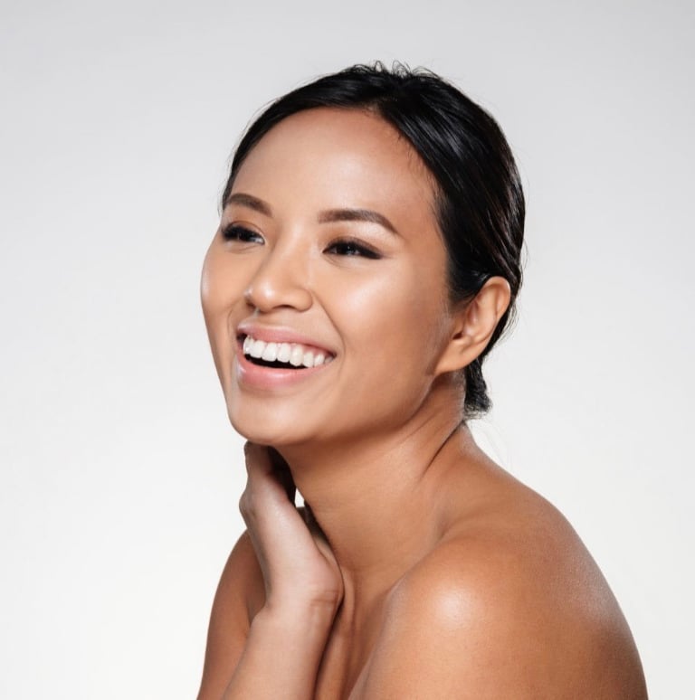 Joyful attractive woman, feeling good after mirconeedling