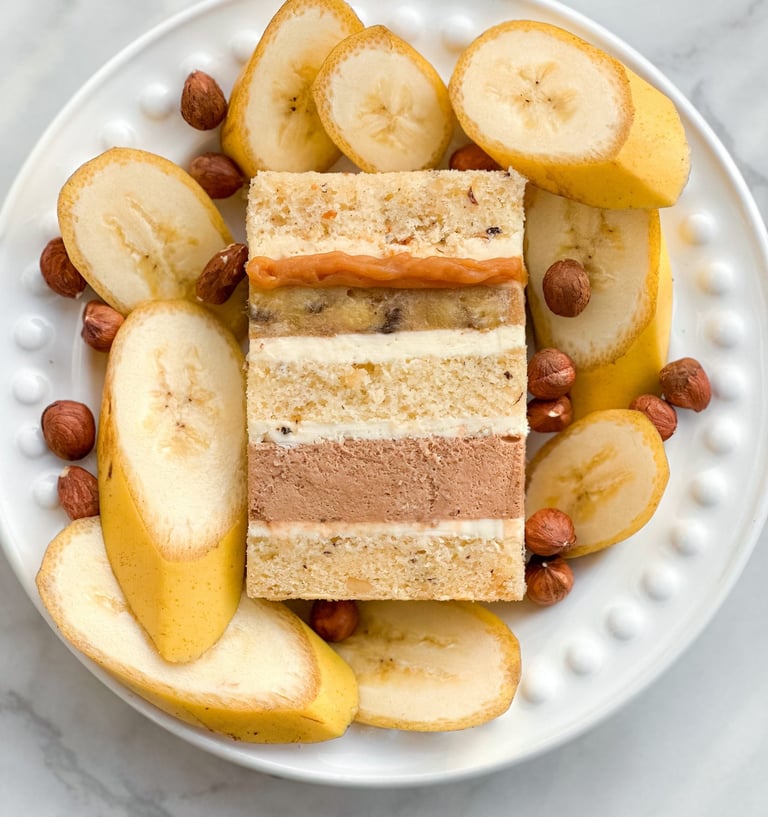 a plate with a slice of cake and nuts
