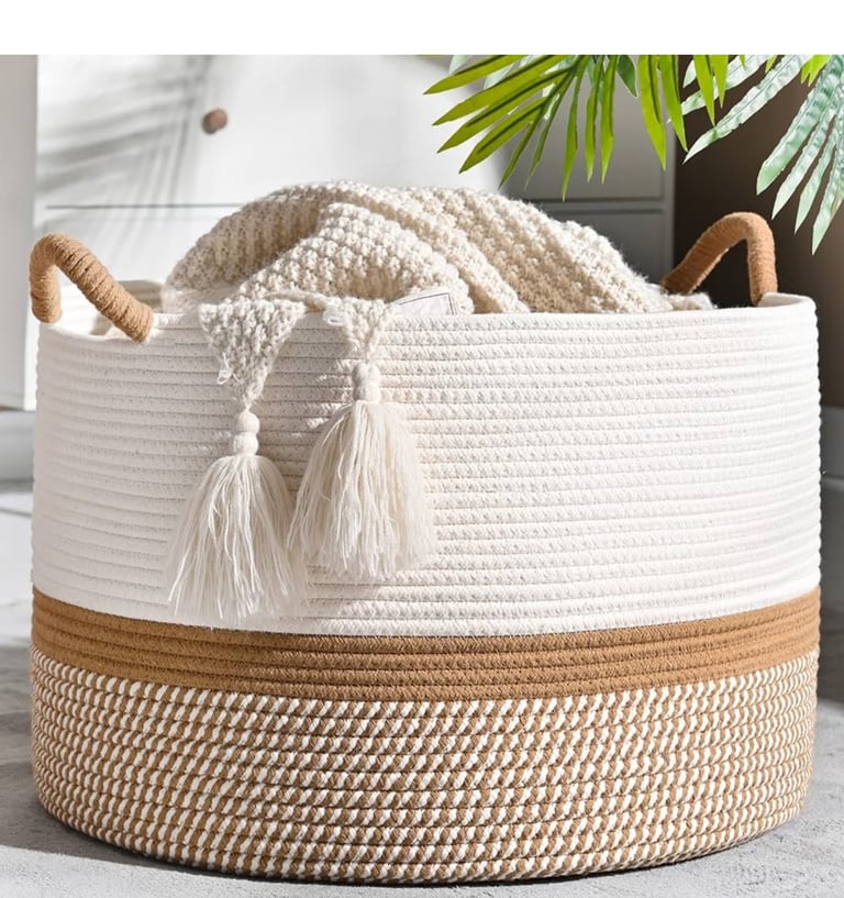 a basket basket with a blanket and a basket with a blanket