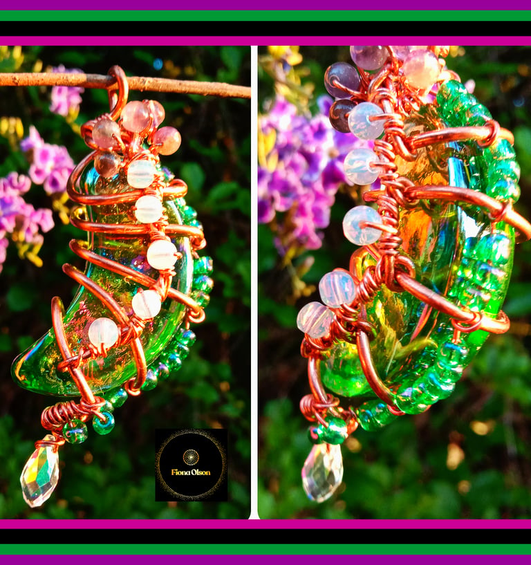 Handmade green glass moon pendant with copper wire wrapping and colorful beads.
