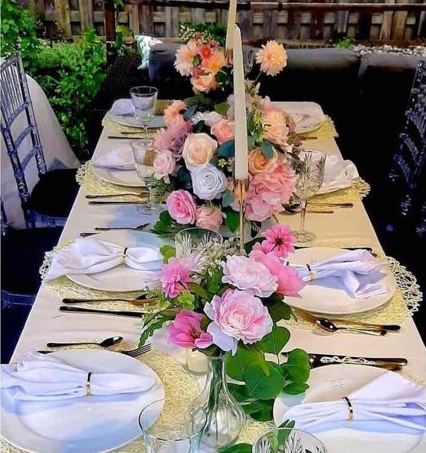 Backyard table setting for 20 guests, centerpieces , candles, tableware