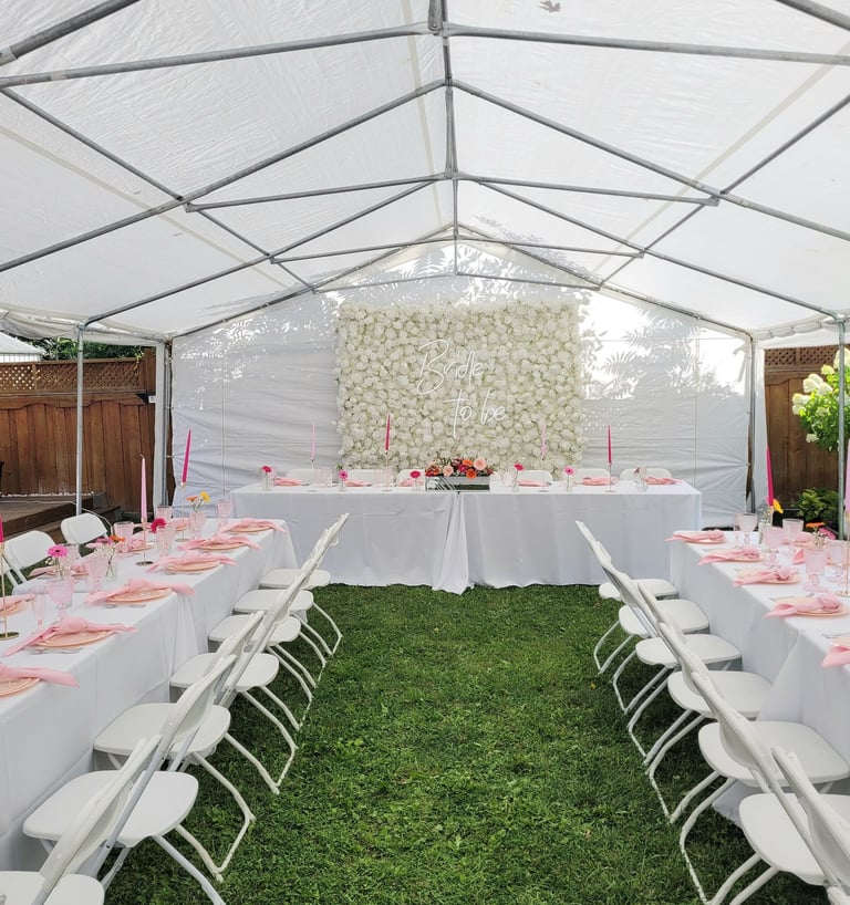 White rose flower wall with Bride to be sign, and tableware
