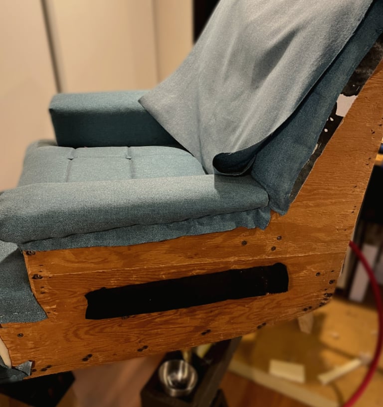 vintage chair in the midst of being reupholstered