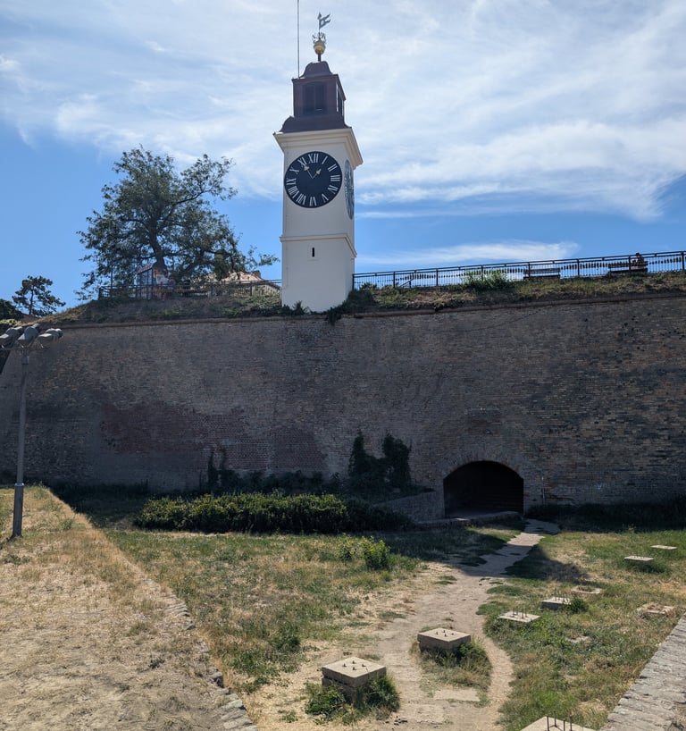Petrovaradin Fortress clocktower standing on top of a stone wall near Novi Sad, Serbia.
