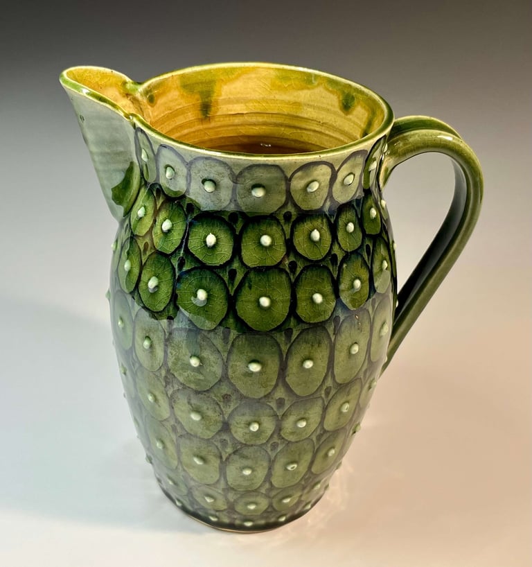 Green glazed pitcher with dots