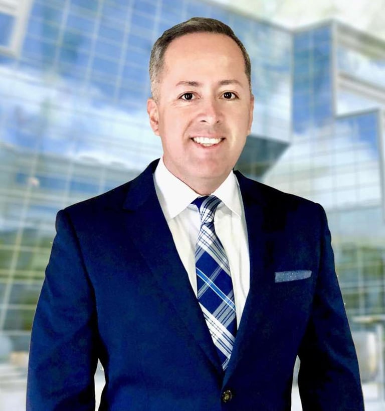 a man in a suit and tie smiling