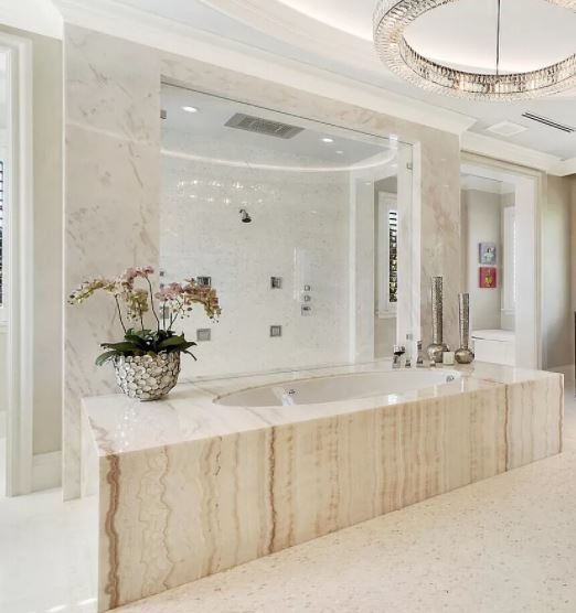 Summerlin Luxury bathroom featuring a large marble soaking tub and glass walk-in shower.